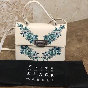 White House Black Market embroidered pebbled bag.